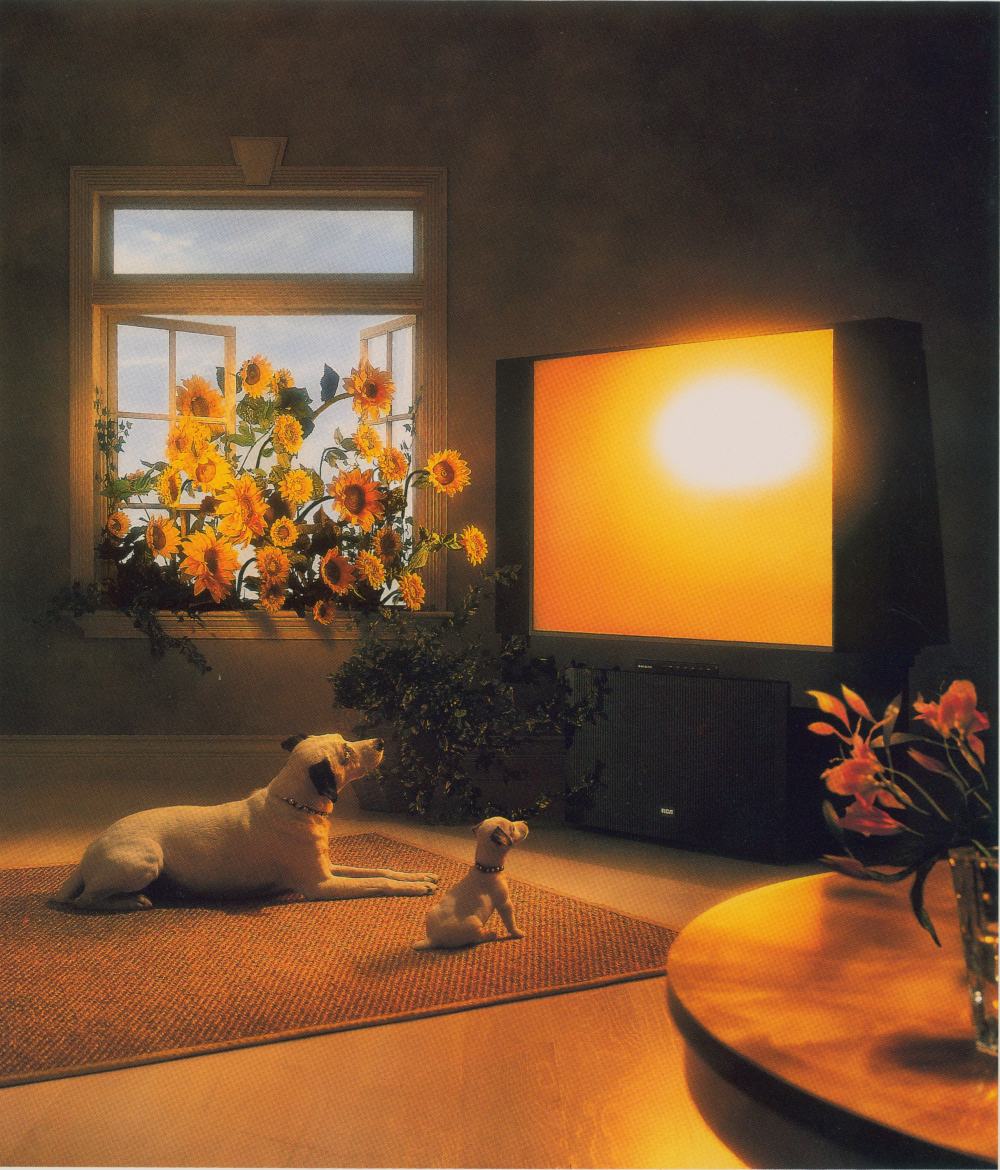 An ad featuring Chipper and Nipper watching tv as sunflowers burst through the nearby window