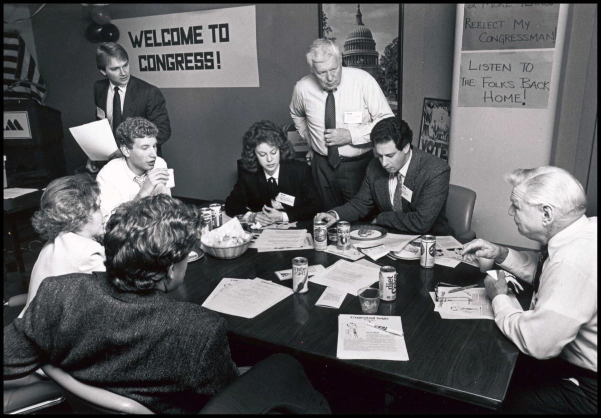 NAM members play their Congressional Insight game around a conference table.