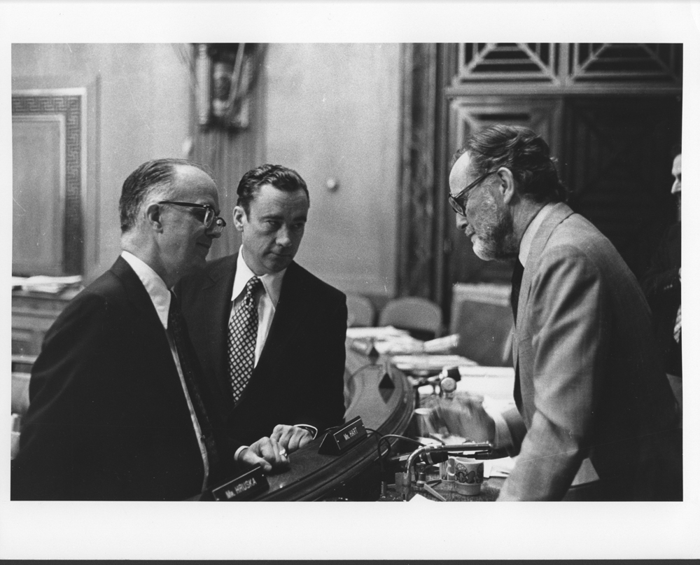 William G. McGowan and Kenneth Cox speaking with a senator