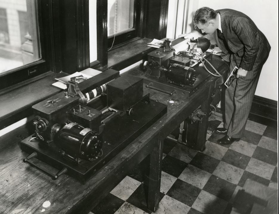 A man uses a RCA machine to send a photograph