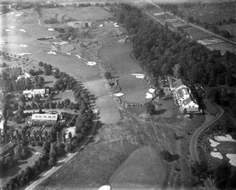 Merion Golf Club during the qualifying round of the U.S. Amateur on September 23, 1930. The Merion clubhouse is the white building on the right.