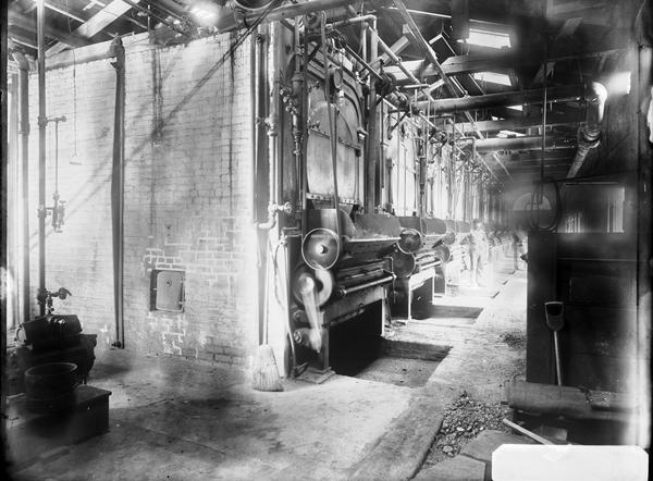 Black and white glass negative showing the  interior of a boiler house, likely at Carney's Point