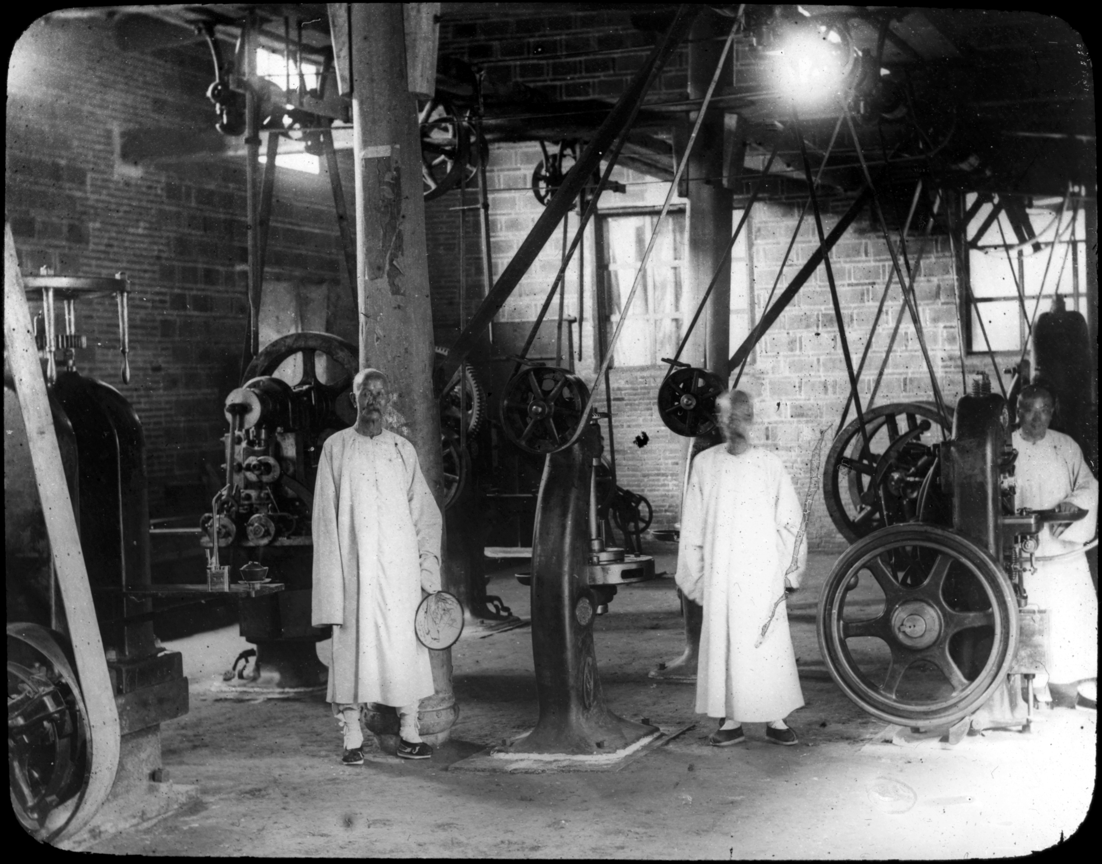 Black and white lantern slide showing lantern slide workers in the Imperial Chinese mint