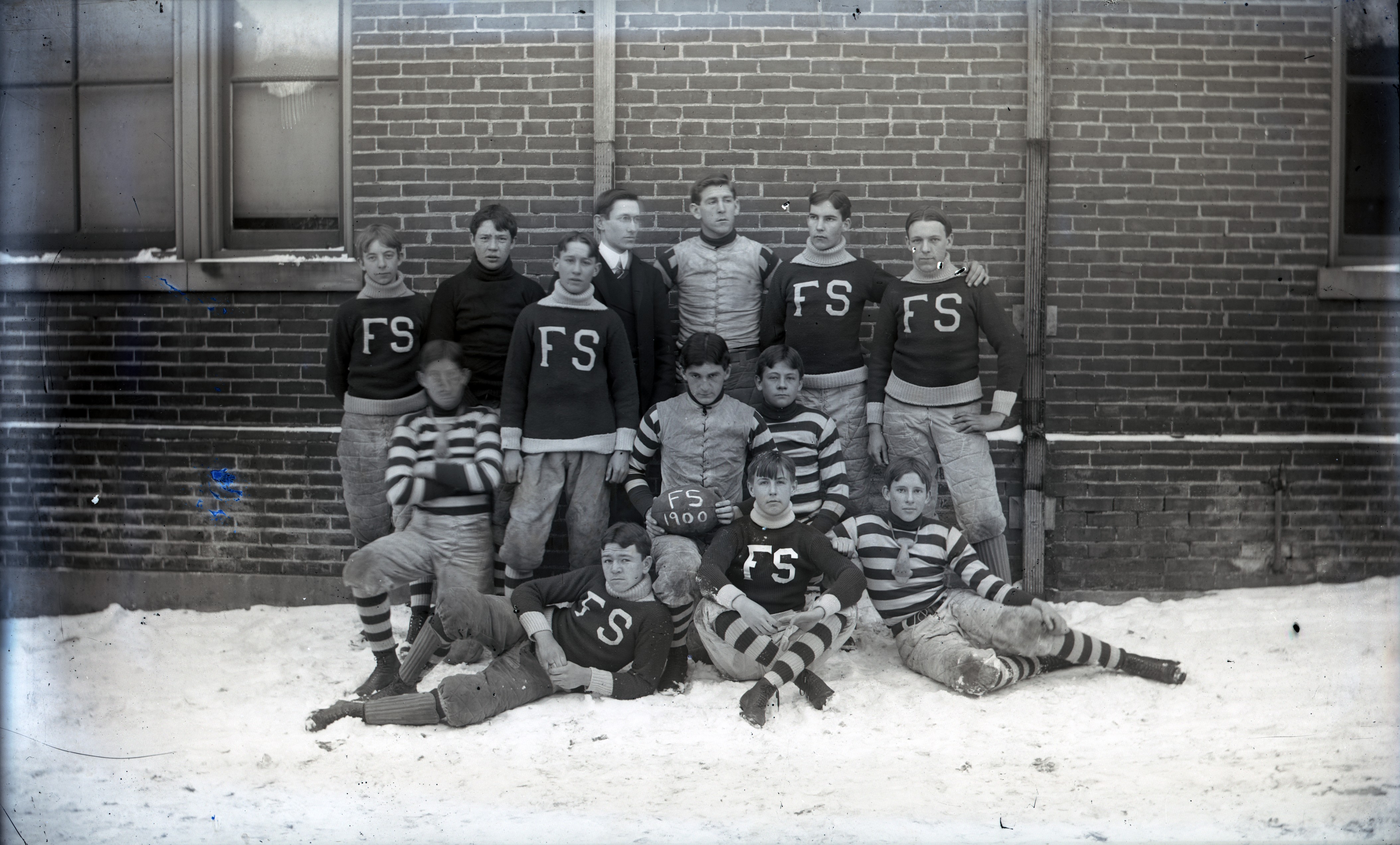 This 1900 glass negative shows the Wilmington Friends School's football team in uniform ...