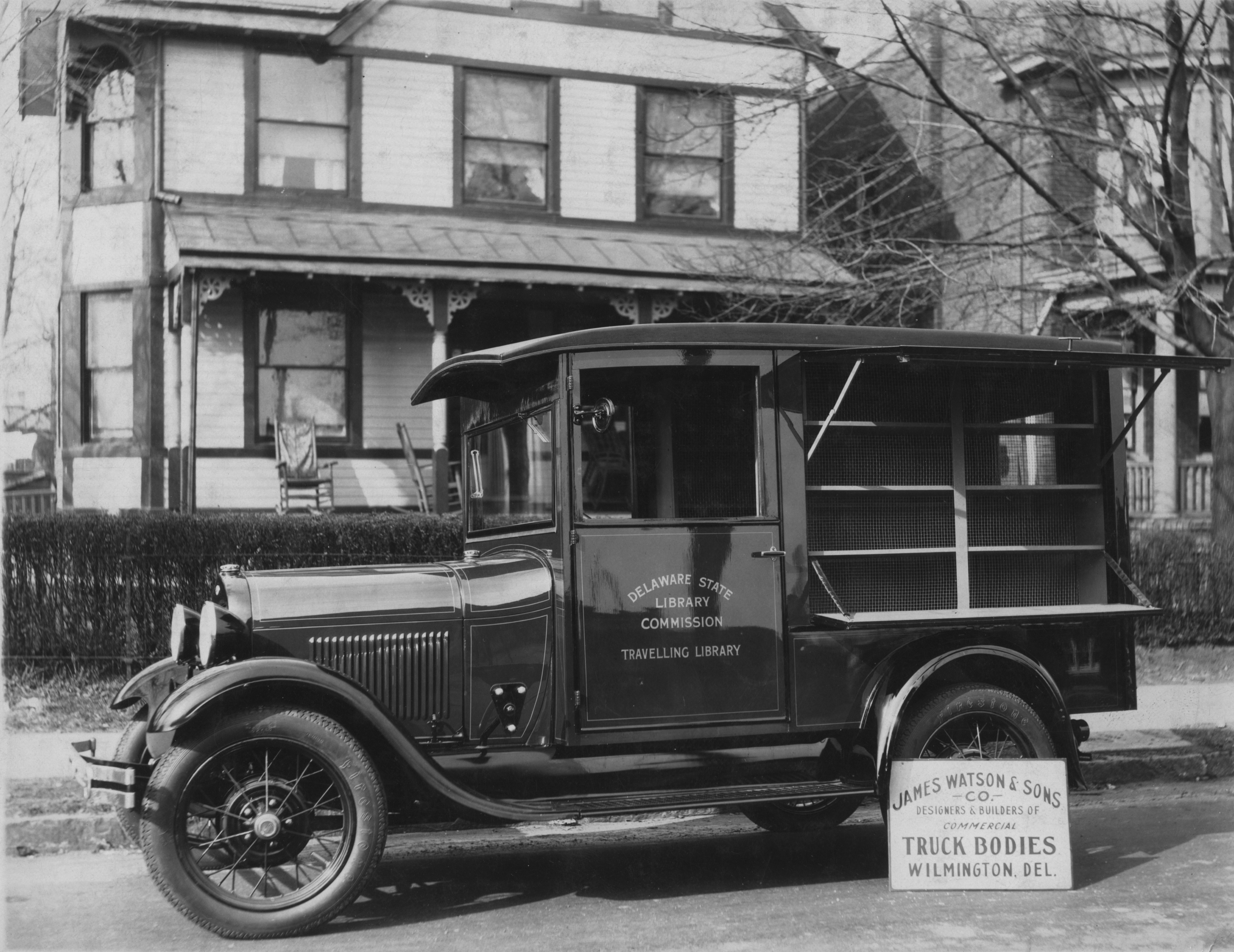 Black and white photo of a bookmobile, circa 1920s, run by the Delaware State Library Commission. 