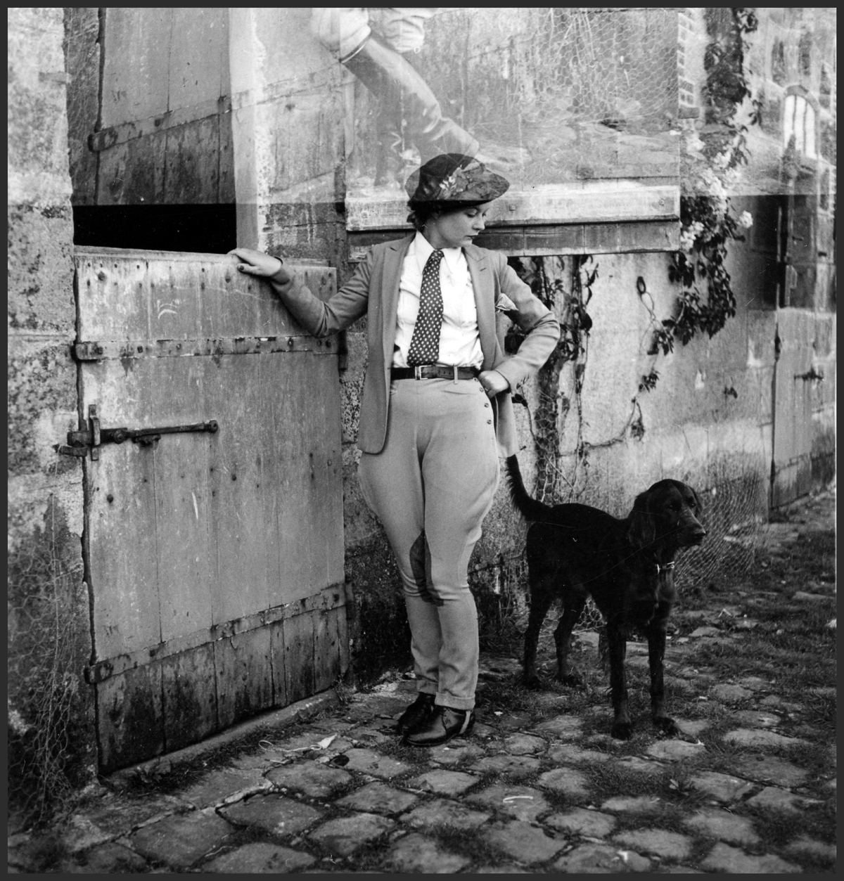 Black and white photo of a woman and dog, likely circa 1935.