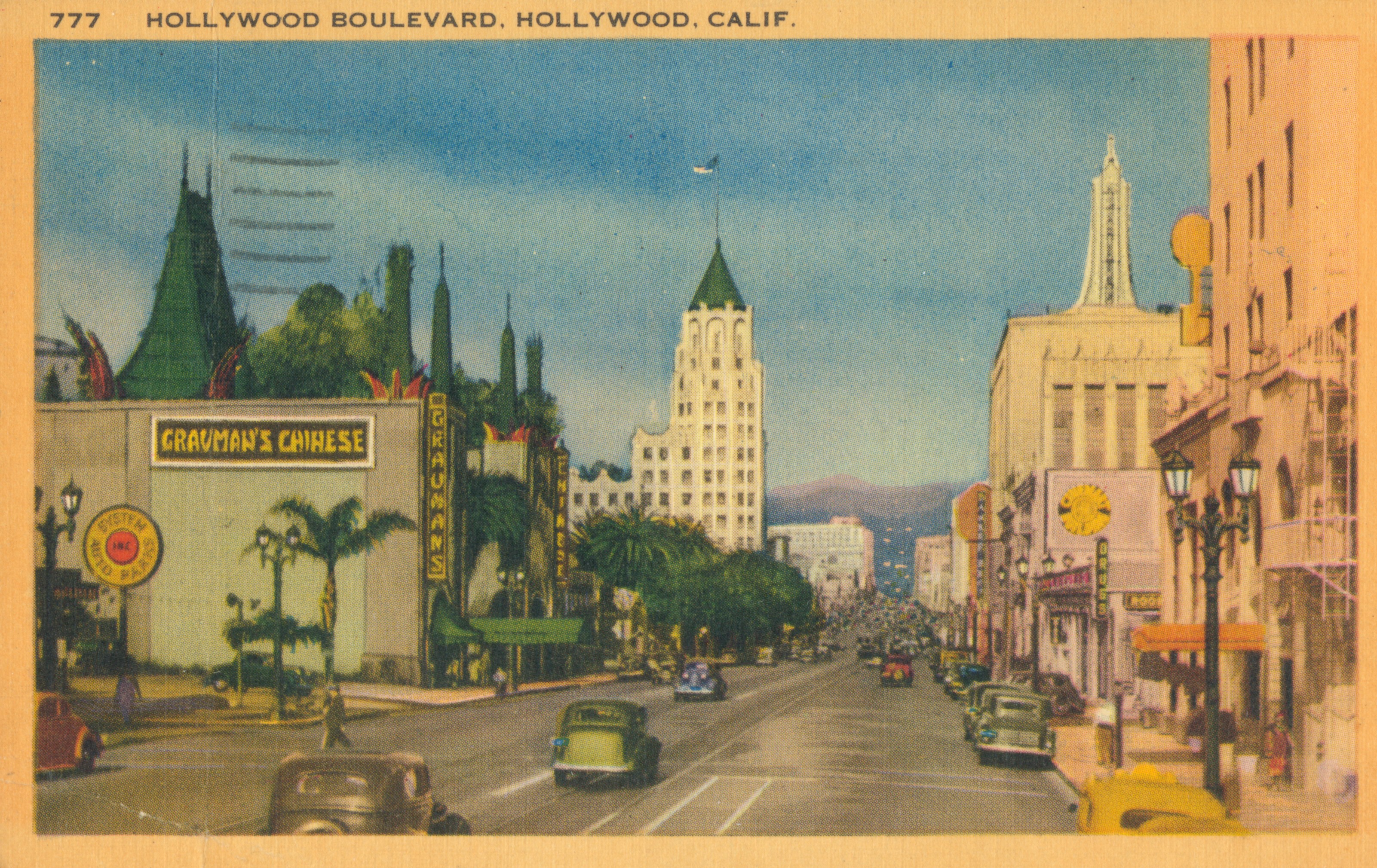 Colorized postcard of Hollywood Boulevard, California.