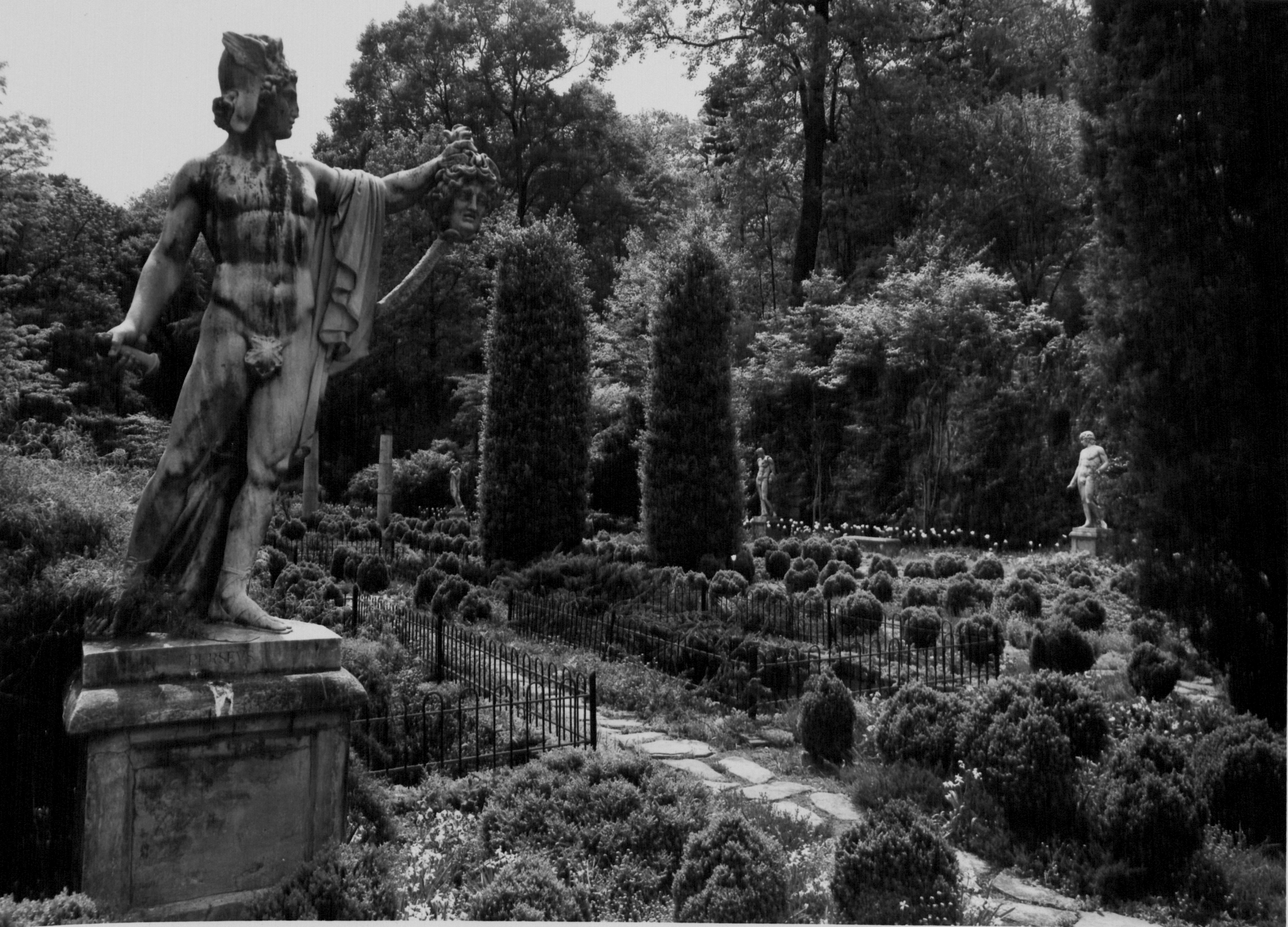 Black and white image of a large formal garden and statuary