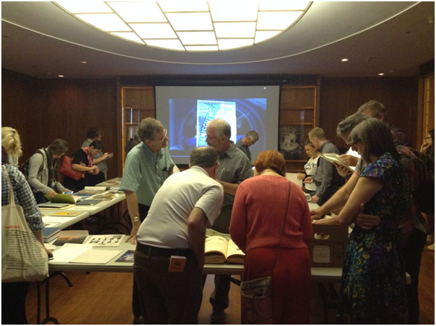 NEH Summer Institute participants viewing items on display in the Copeland Room