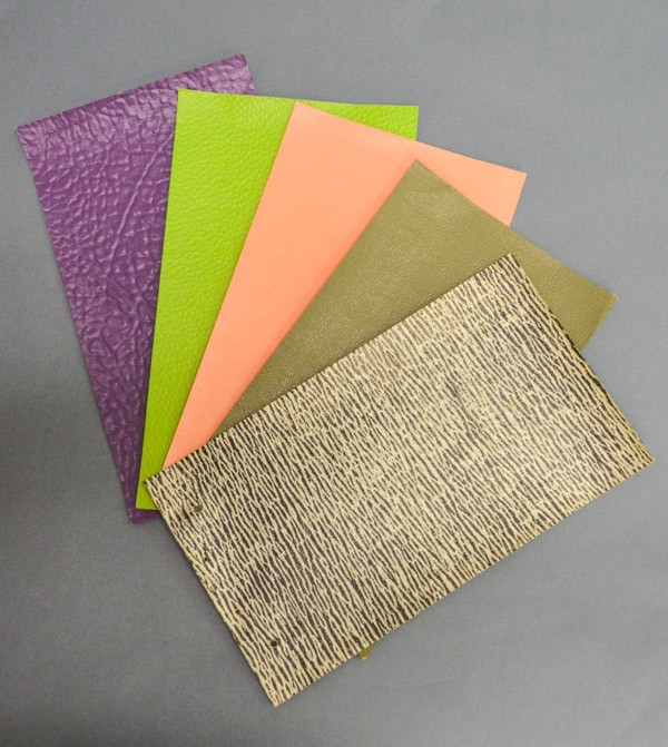Various colors and textured samples of DuPont Fabrikoid.