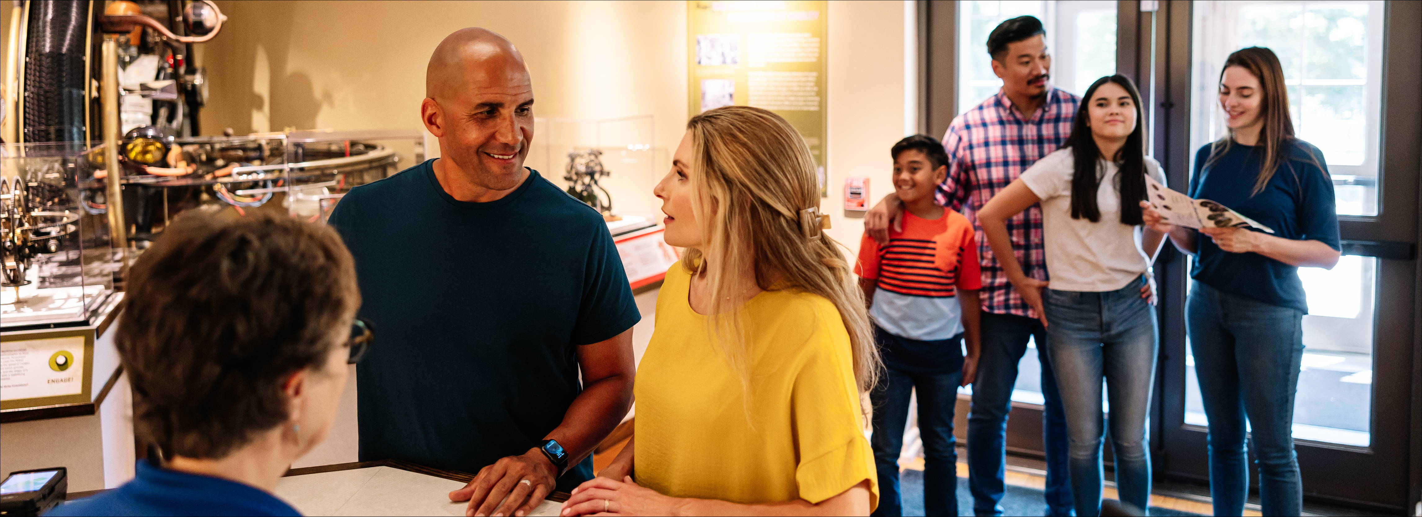 people at a ticketing desk