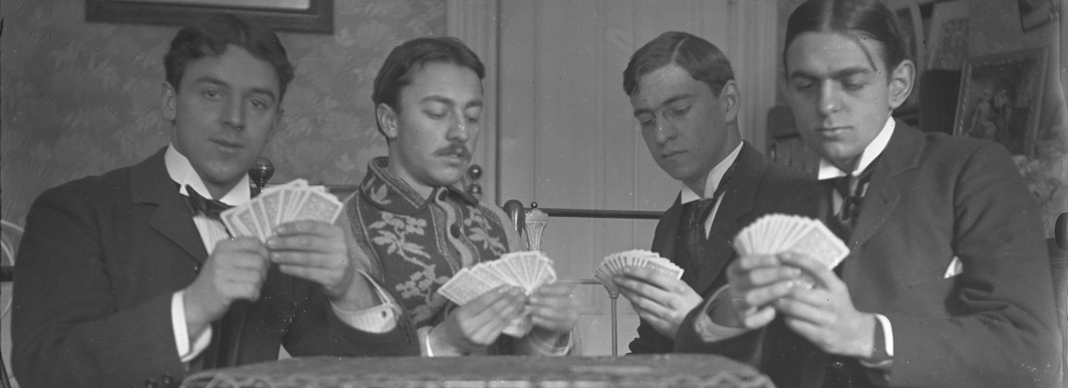 P.S. du Pont playing cards with three friends at MIT, circa 1889