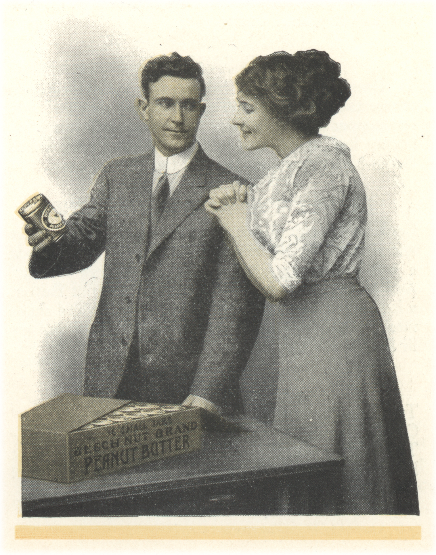 Partial color illustration of a man showing a woman a jar of peanut butter from a box of jars.