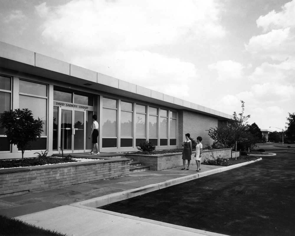 Three women at the library entrance