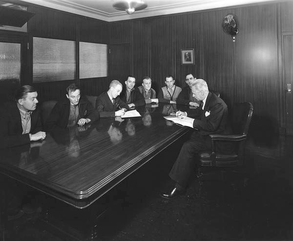 A.G. Spiegelhalter and employees of the Pusey & Jones Corporation signing a labor agreement with C.I.O