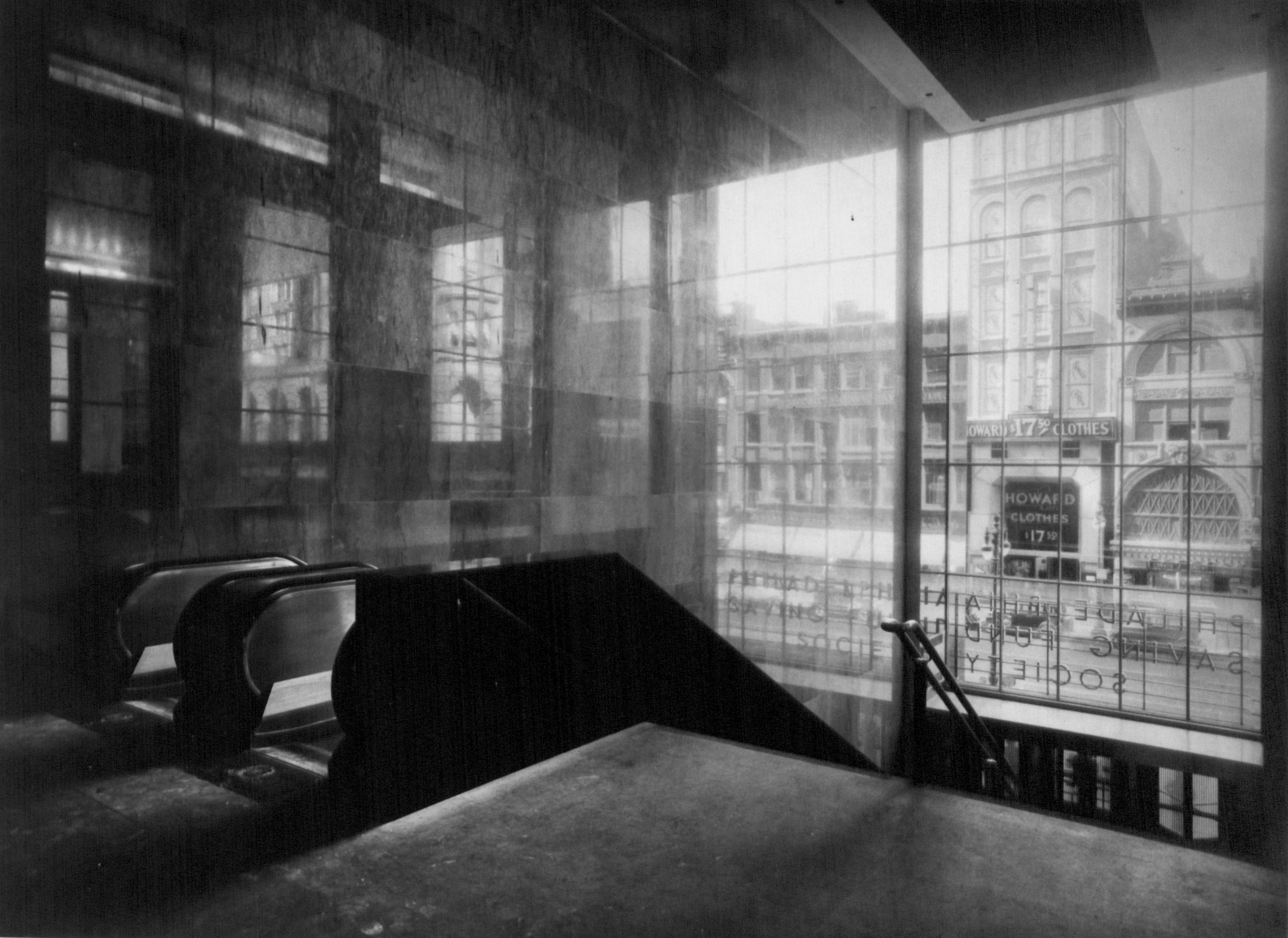 Looking down to street level from stairway and escalator in PSFS Building