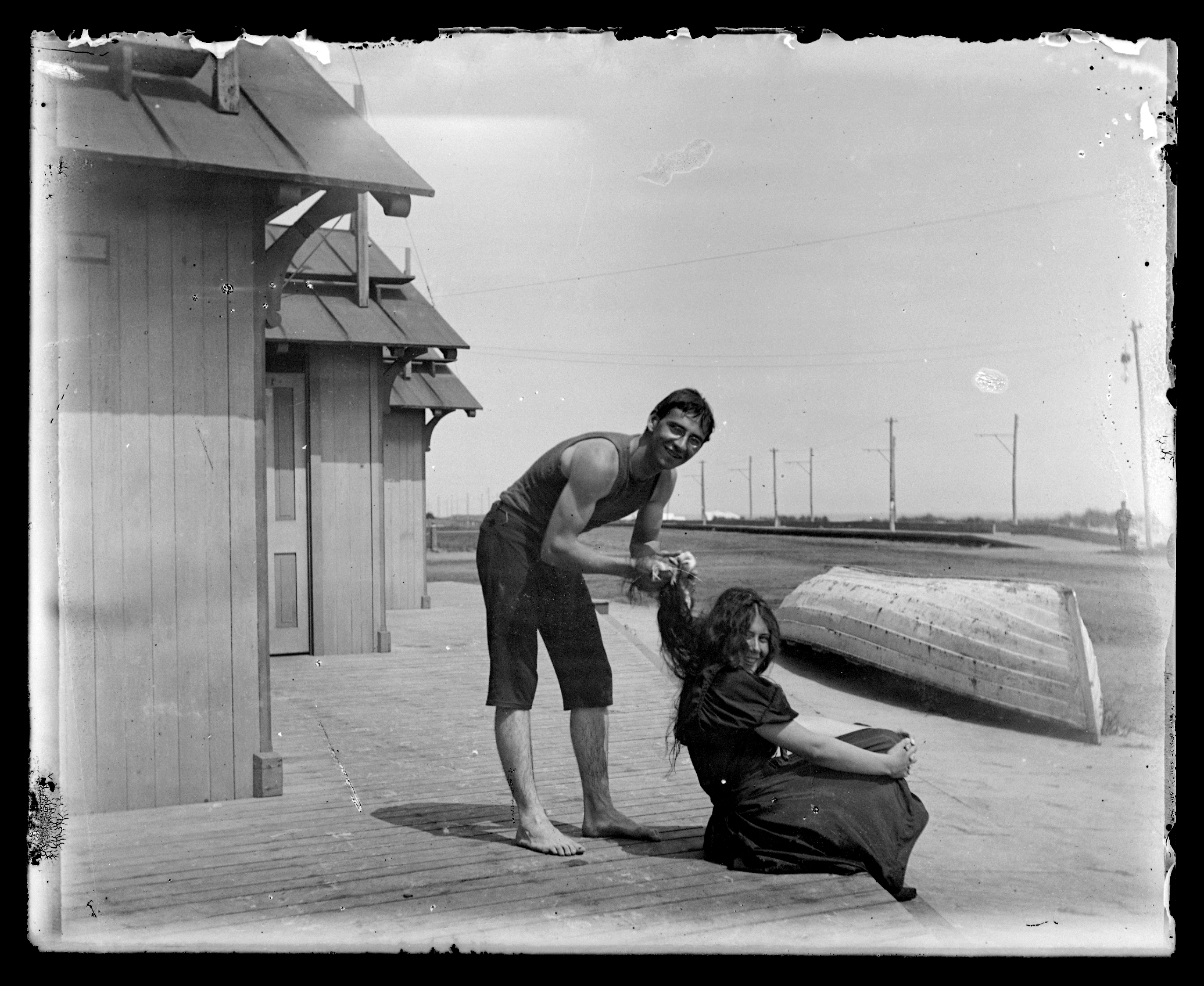 Black and white glass negative of a man and woman near the beach in Cape May.