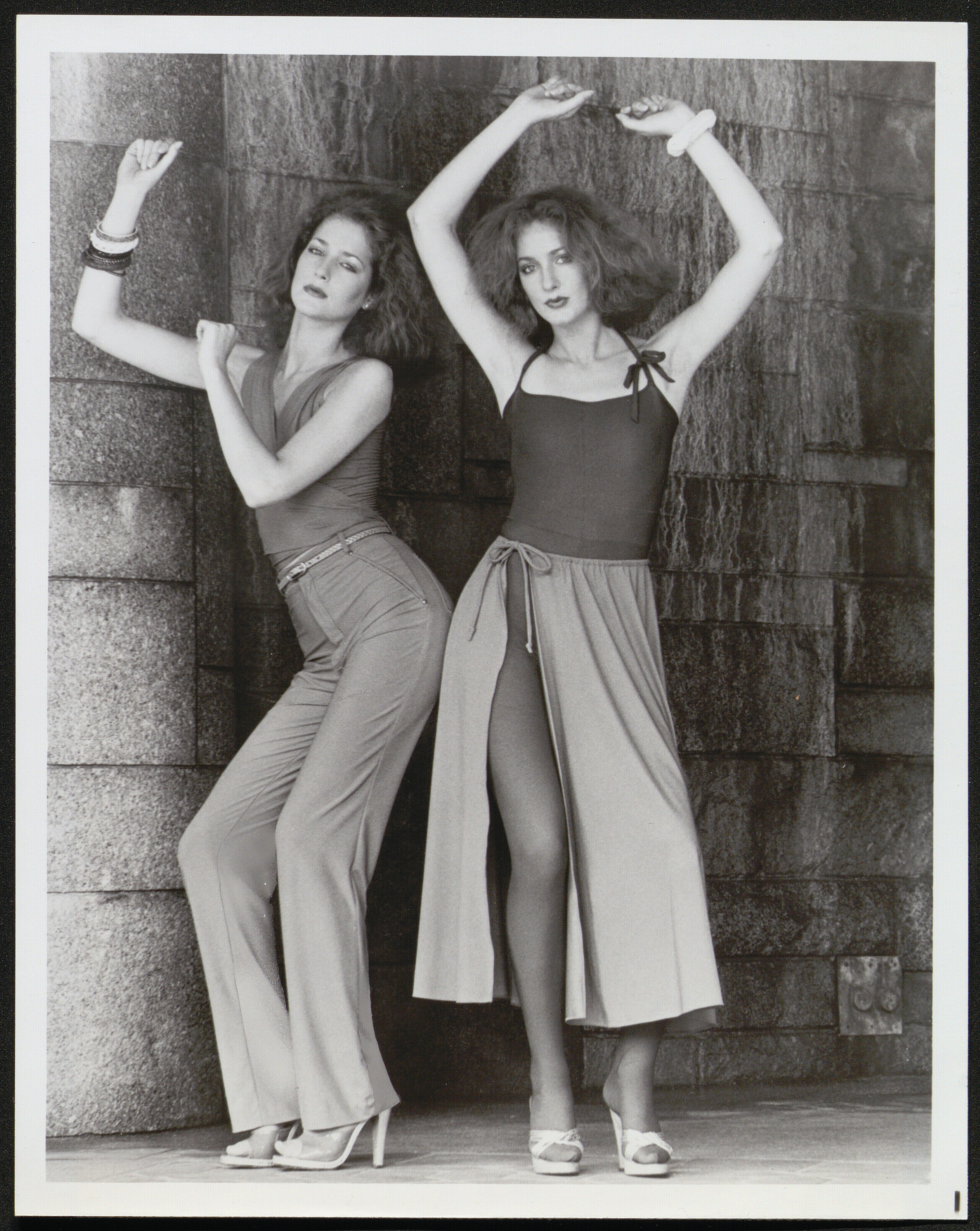 Black and white photograph of two women modeling "Disco Bodywear"