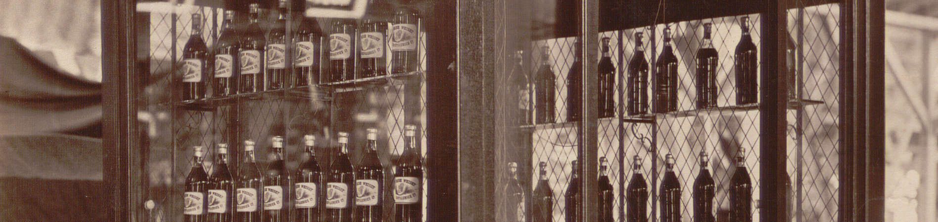 Whisky in bottles and barrels