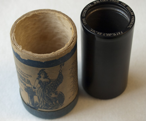 A cylinder with its cardboard container