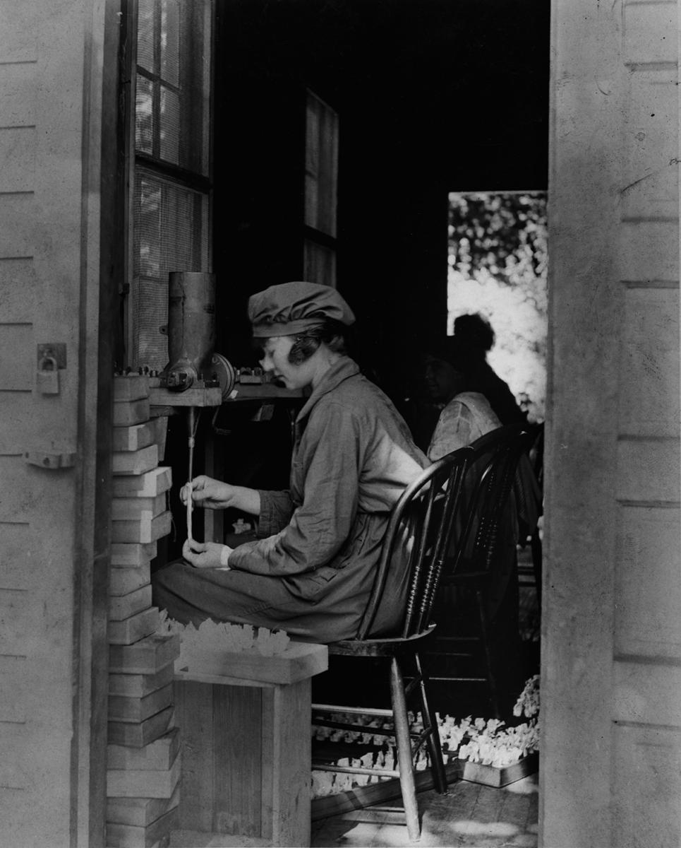 Woman filling powder into silk bags at DuPont’s Brandywine Mills, 1918.