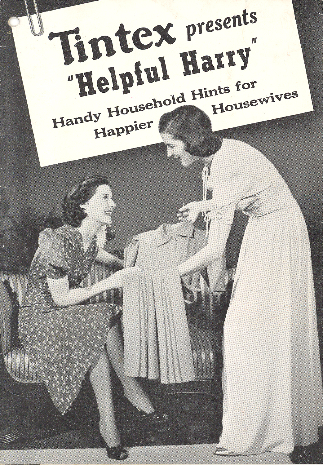 Pamphlet cover. Black and white photo of a woman displaying a dress on a hanger to another woman seated on a couch.
