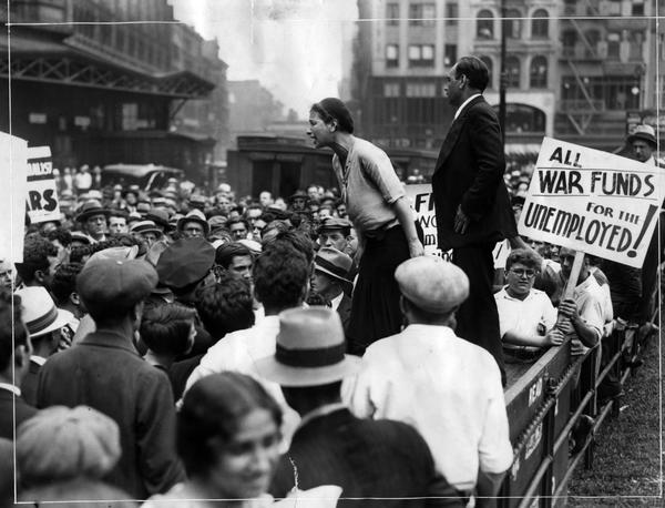 This photograph shows June Croll, a representative of the Communist-affiliated National Textile Workers Union, speaking at a Jobless March that occurred in New York City on July 7, 1931