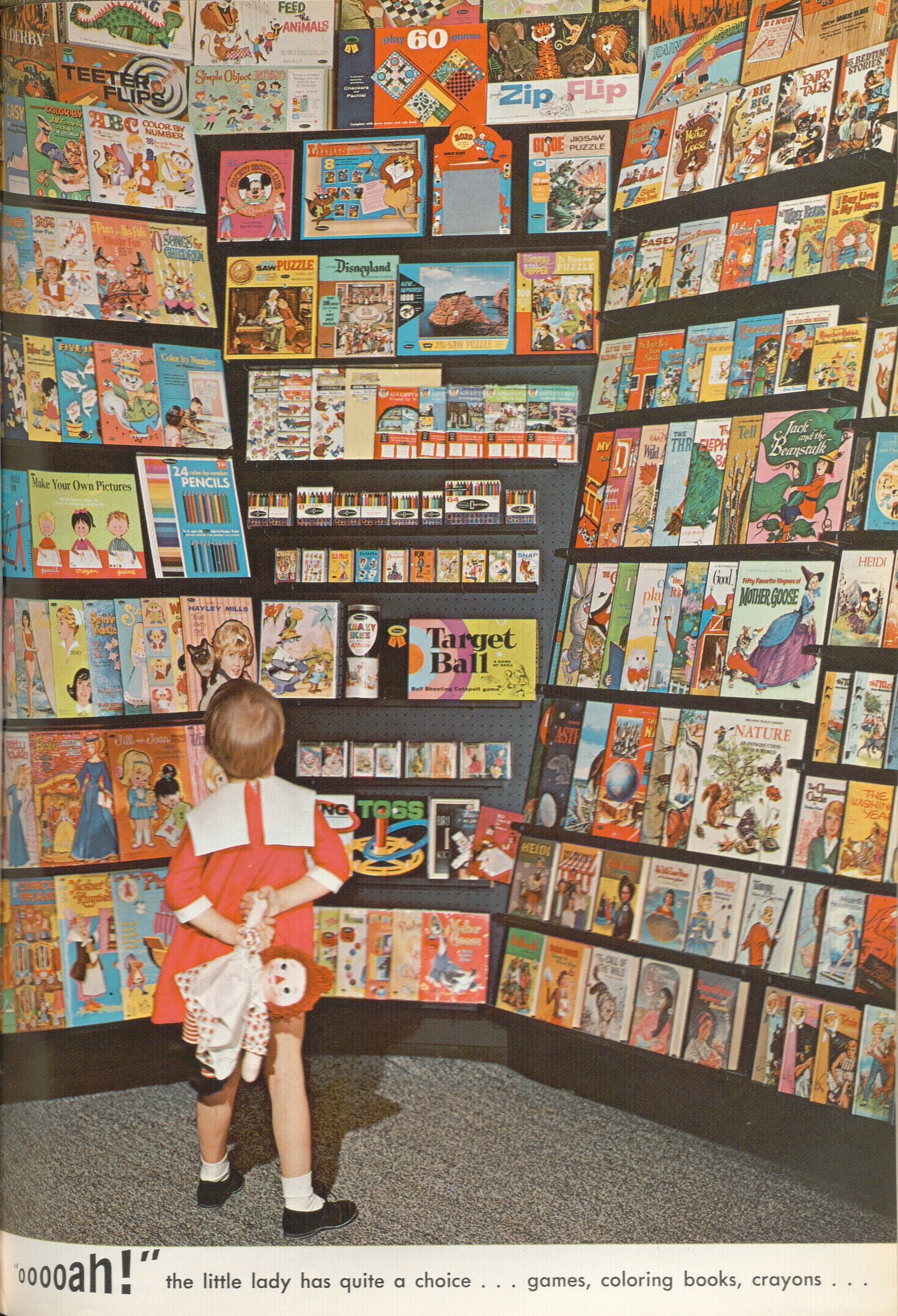 Ad for children's activity books and games showing a little girl perusing a large rack of products.