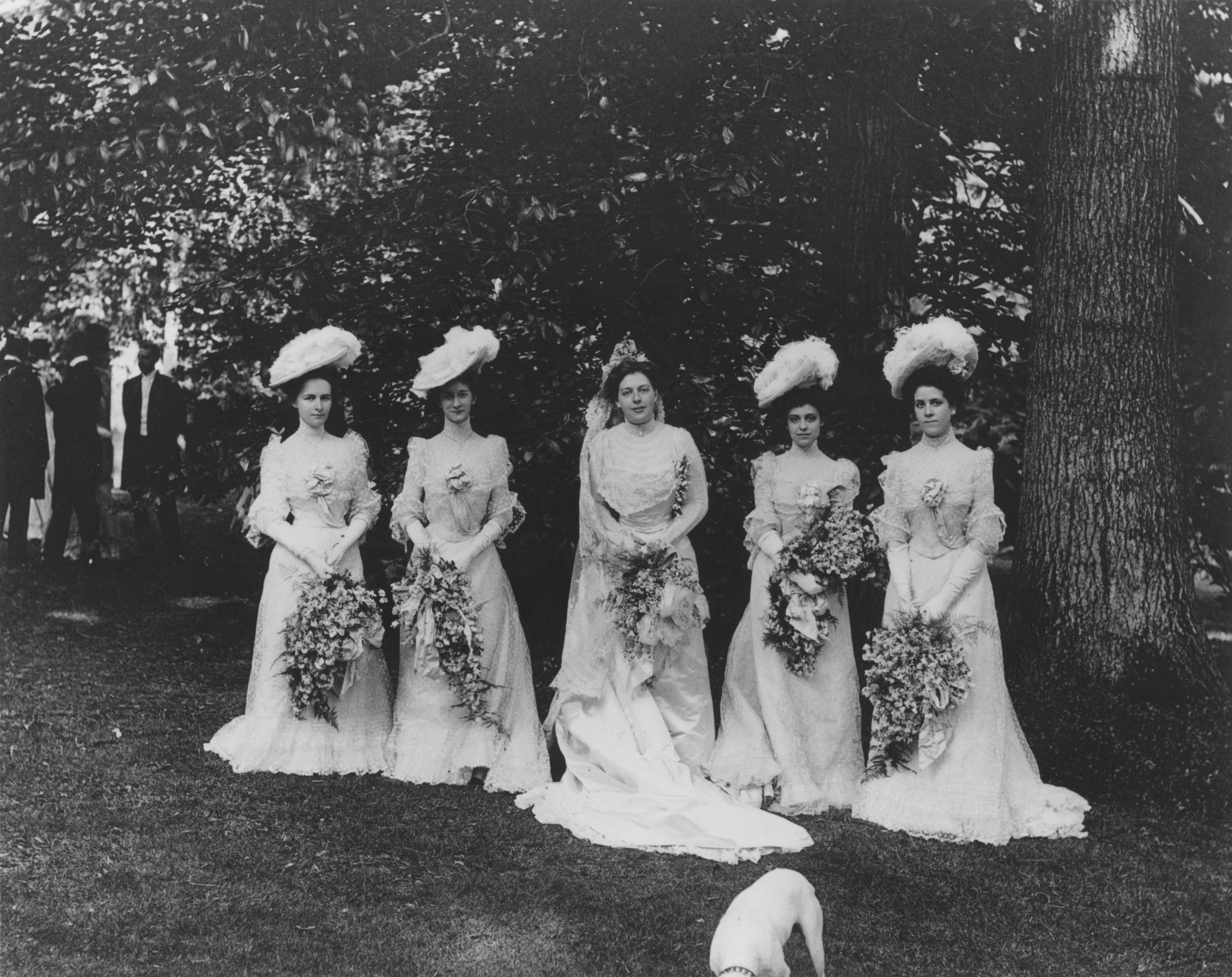 Black and white group photo of Louise du Pont Crowninshield on her wedding day with her bridesmaids.