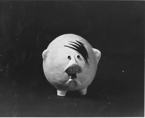A piggy bank with Hitler hair.