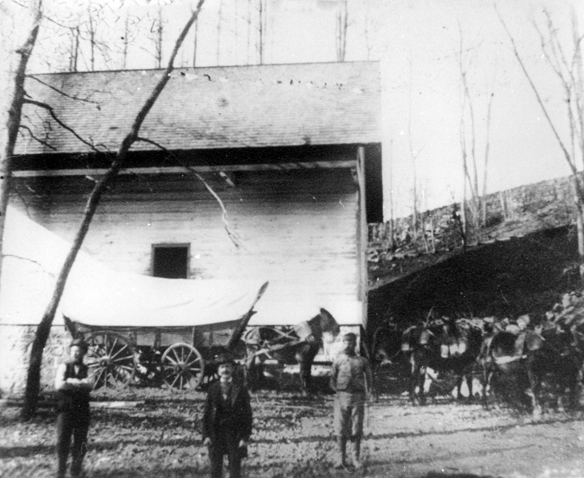 Lower powder yards, worker stands with wagon and horse