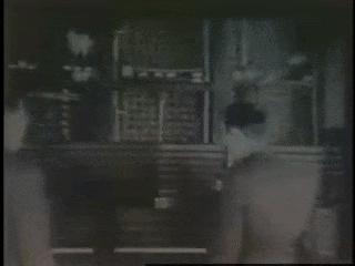 Gif showing black and white footage of men and women demonstrating ENIAC