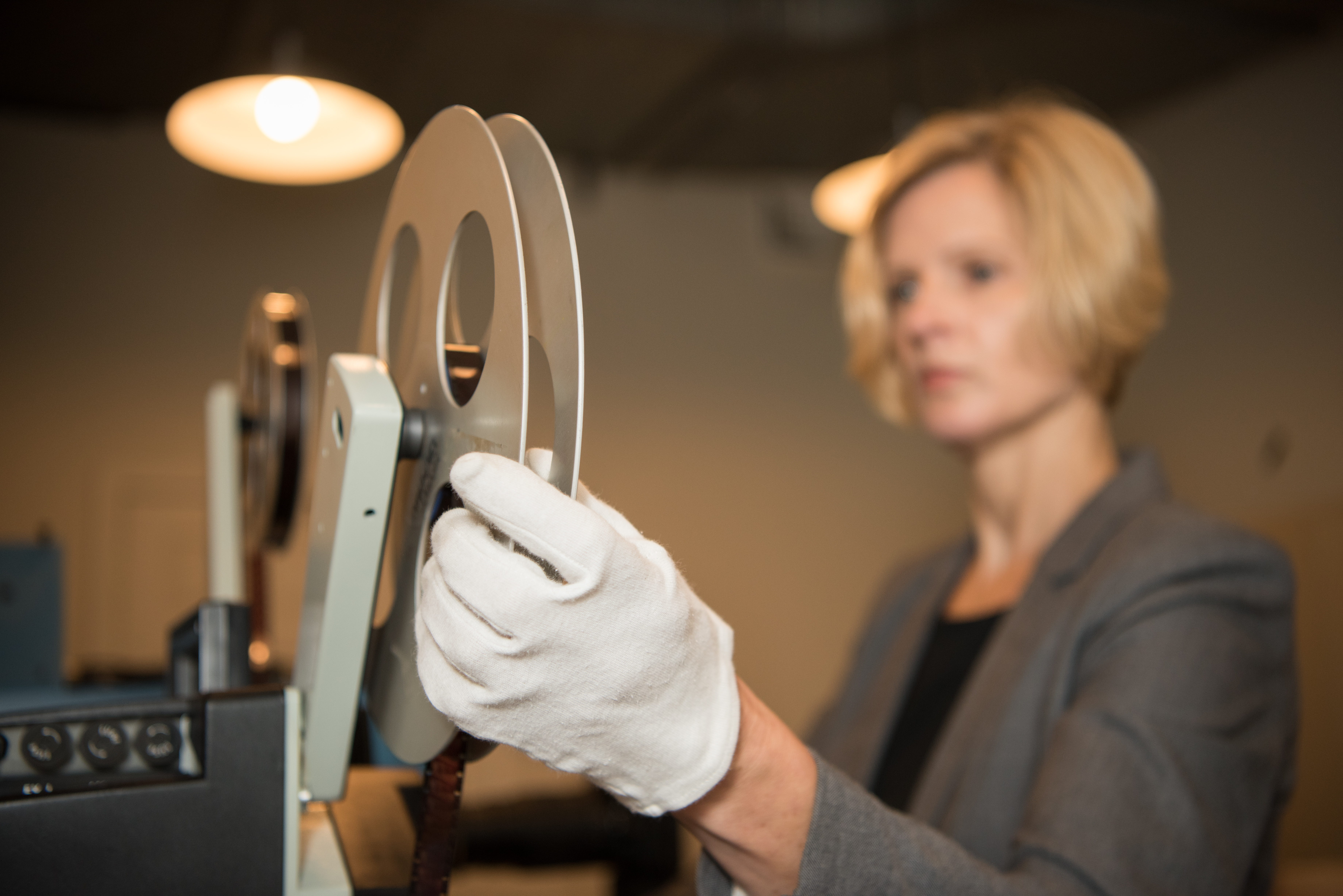 Archivist holding film reel