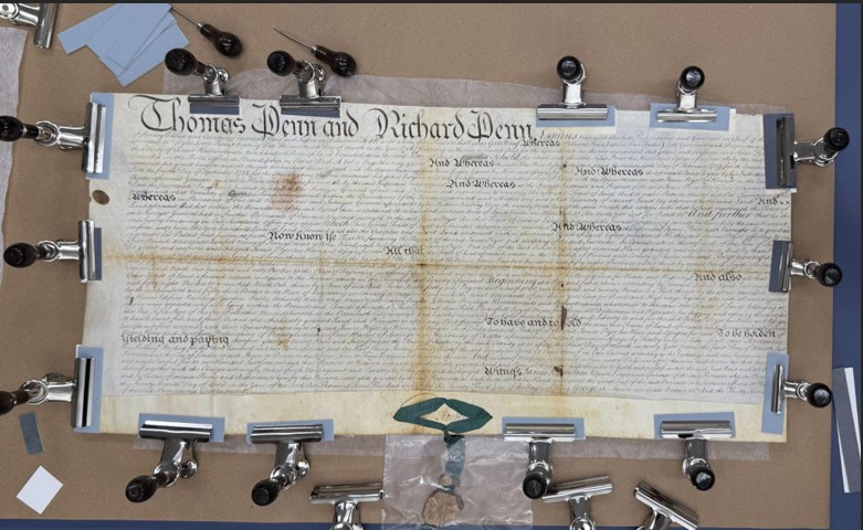 Penn land document being flattened for conservation