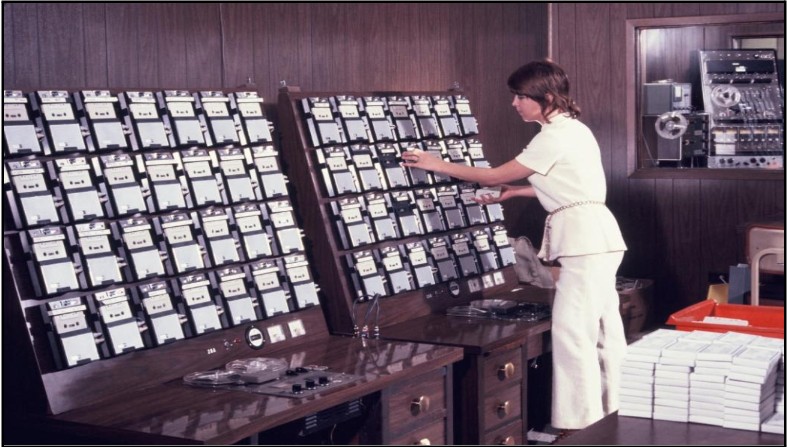  A Storycraft staff member mounting cassette tapes into the duplicating equipment. 