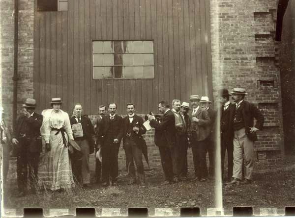 Group of men and women drinking outside the Ardgowan Distillery