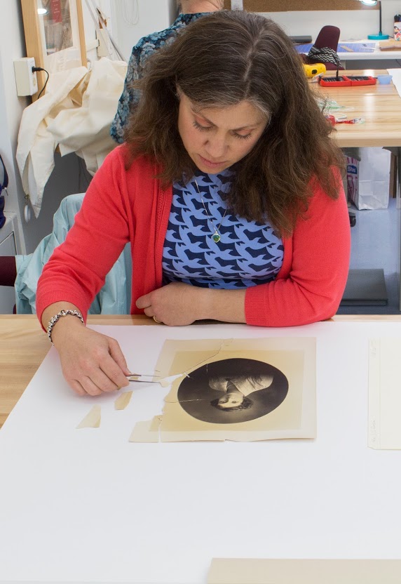 The author works on repairing a photograph