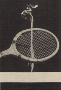 A tap runs water over a tennis racket