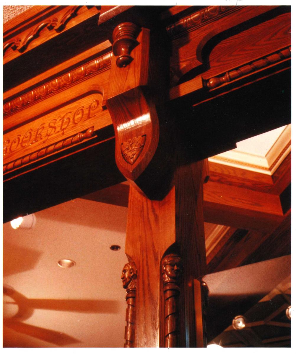 The column to the right of the Gothic Bookshop entrance – Ken White’s likeness is the head on the right of the column.
