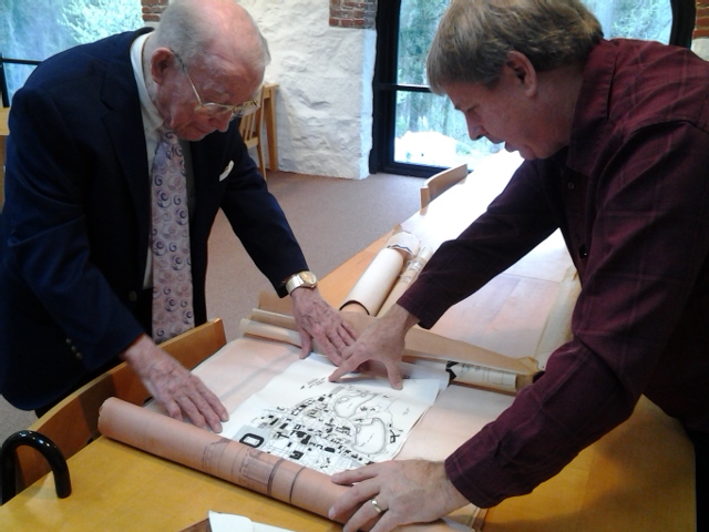 Ken White and his son, Andrew, unrolling one of the plans from the  new additions to his collection here at Hagley.