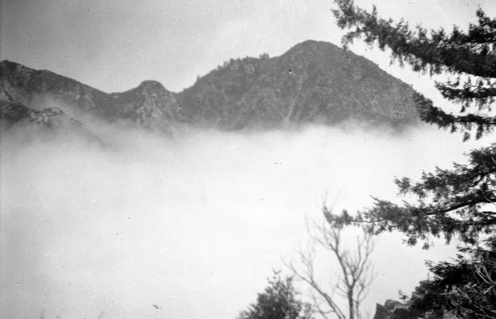 Black and white image of foggy mountains