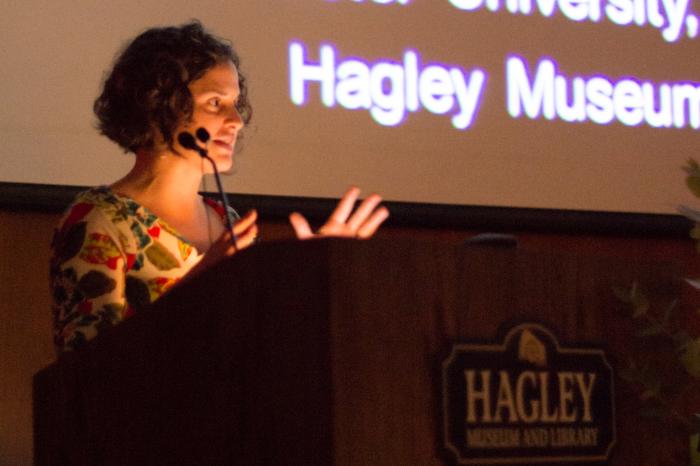 woman speaking behind podium at Hagley