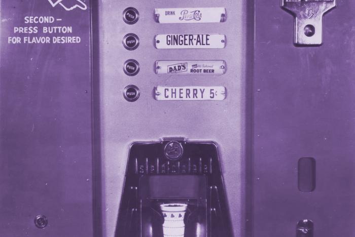 Archival image of a 1955 soda vending machine