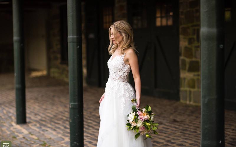 bride behind barn