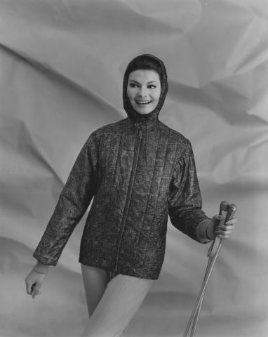 Fashion photograph of a woman in a ski parka.