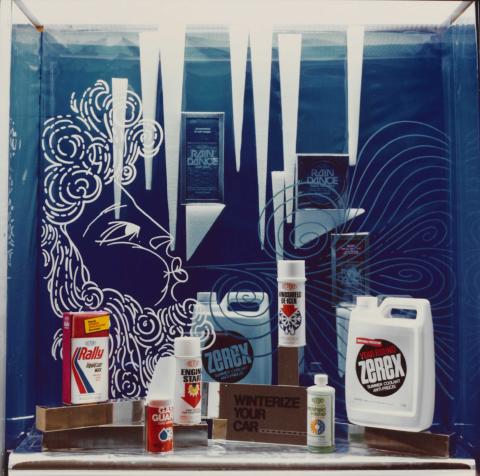 Photograph of a store window displaying DuPont winter car products.