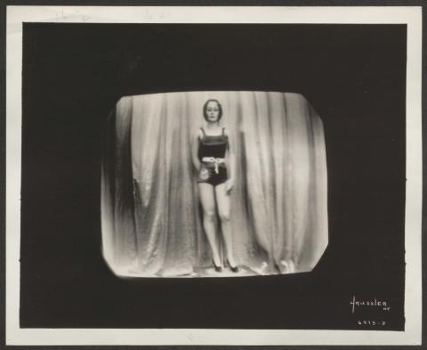 Black and white photograph of a mannequin in a woman's swim suit.