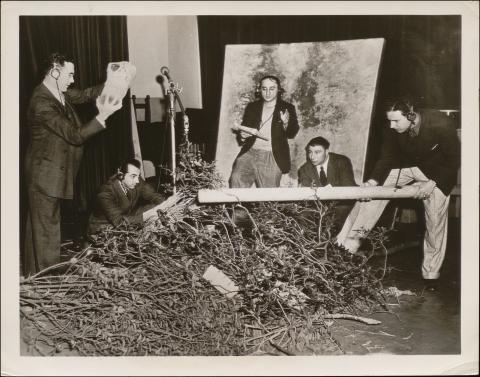 Arch Oboloer (center), NBC author, producer, and director, oversees falling tree sound effects using a real tree and real undergrowth for episode No. 262, 'An American is Born'.