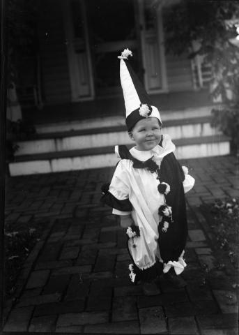Toddler in a clown costume
