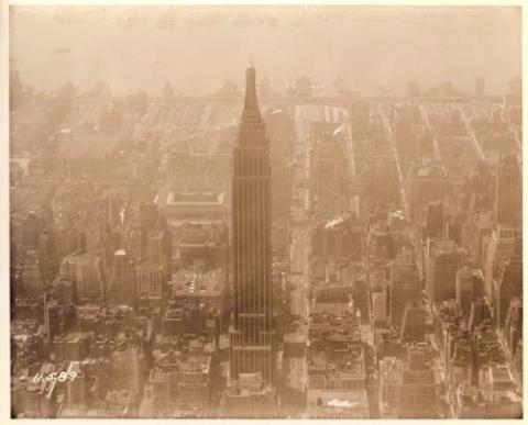 Sepia toned aerial photograph of the Empire State Building.